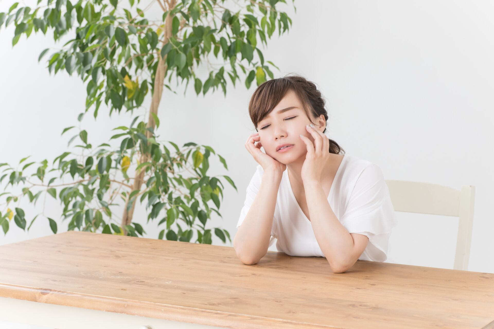 体調悪い女性